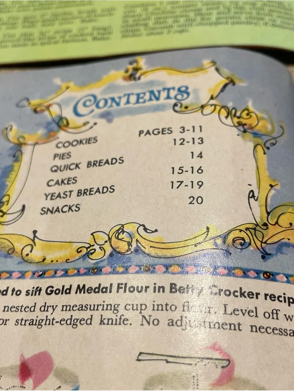 Betty Crocker cookbook set with purple, orange, and yellow covers